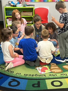 Early childhood teacher and child at St. James Preparatory Academy