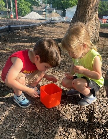 Early childhood students exploring nature at St. James Preparatory Academy